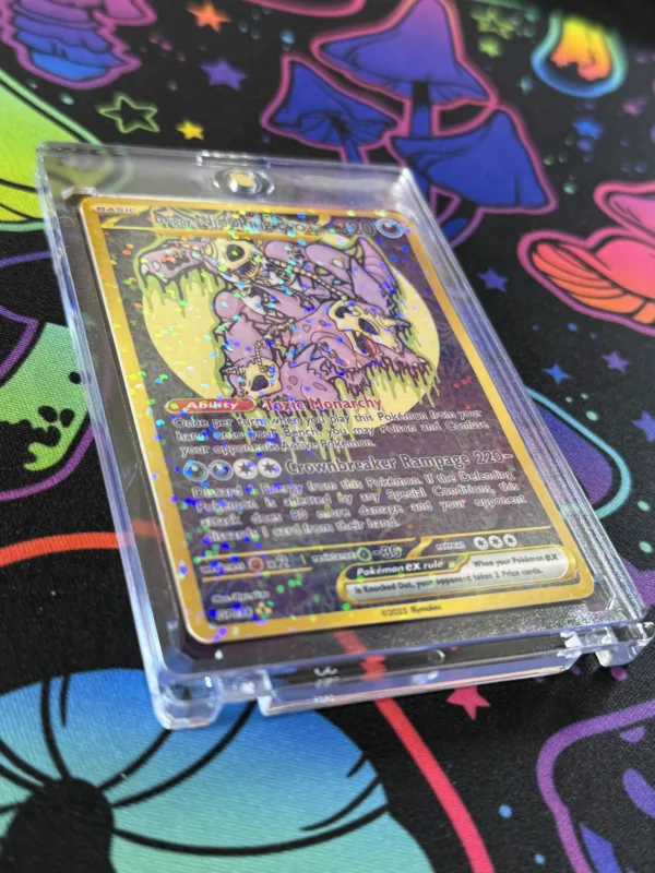 Angled view of Drippy Nidoking Evo EX card showing holographic shine and dark type gold design in protective slab