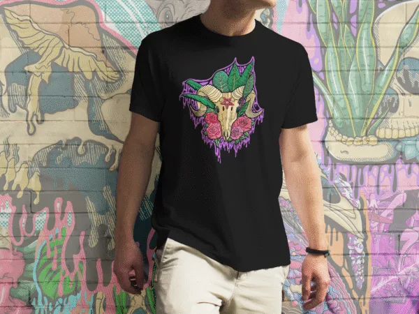 A Drippy Baphomet Skull tee in black, featuring a haunting goat skull with curling horns, lush green leaves, red roses, and an ominous pentagram on the forehead. The vivid purples, reds, and greens pop against the dark background, perfect for occult art lovers, gothic fashion fans, and horror enthusiasts.