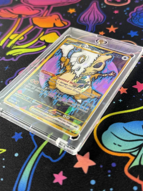 Angled view of handmade Drippy Cubone EX card showing holographic shine and skull design, no packaging