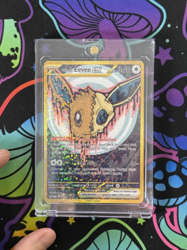 Custom Drippy Eevee EX card featuring cute skull artwork, gold border, and holographic shine in magnetic slab