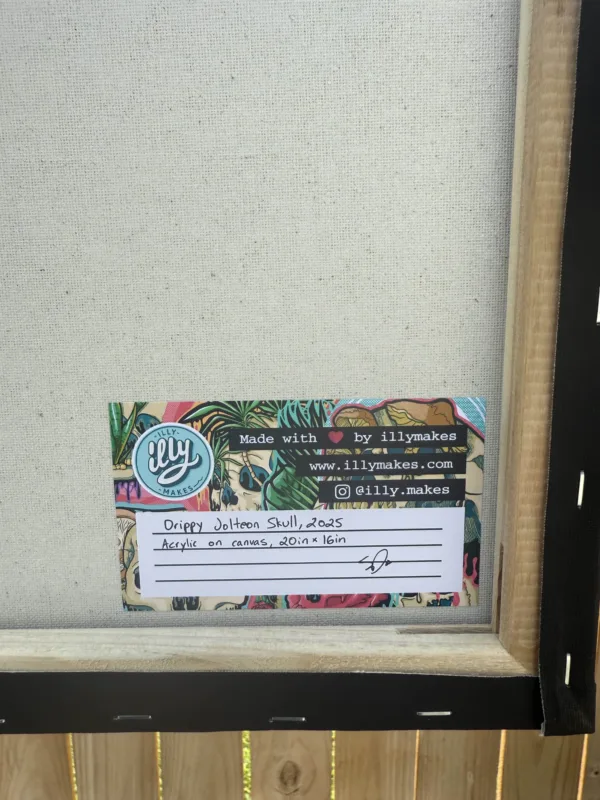Back of the Drippy Jolteon Skull acrylic painting, showing artist’s handwritten autograph, “1 of 1” labeling, and authentication details.