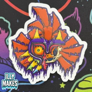 decal featuring Zelda gothic artwork of Majora’s Mask fused with Skull Kid, illustrated in vivid melting colors including purple, red, orange, yellow, teal, and black dripping accents, by illymakes.