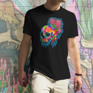 Black t-shirt featuring vibrant LGBTQ+ pride gothic illustration of a melting rainbow skull paired with lush pink and green bromeliad flowers, original artwork by illymakes.