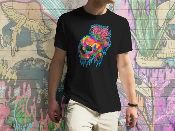 Black t-shirt featuring vibrant LGBTQ+ pride gothic illustration of a melting rainbow skull paired with lush pink and green bromeliad flowers, original artwork by illymakes.
