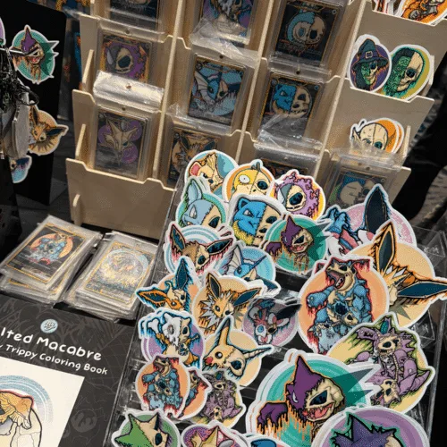 Some of my handmade art stickers, custom art trading cards, and art coloring books.