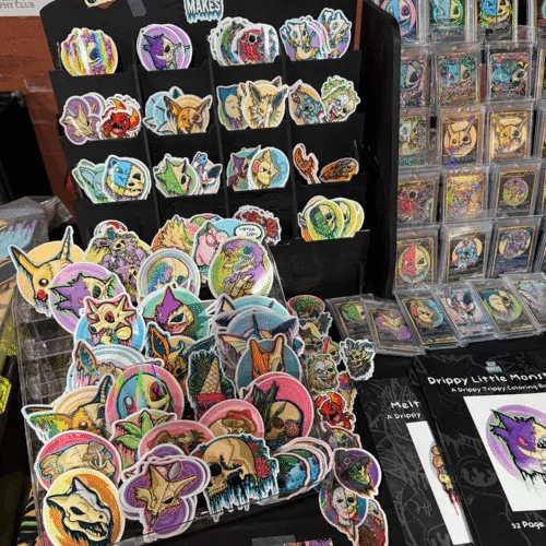 Some of my handmade art stickers, custom art trading cards, and art coloring books.
